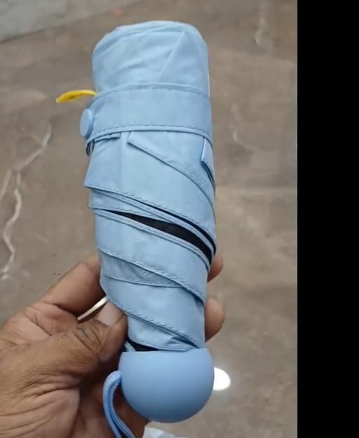 Mini Capsule Umbrella – Compact, Lightweight & Portable Rain Protection